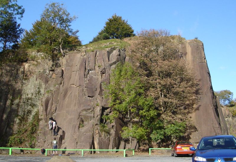 Climbers on quarry rock face in Auchinstarry Park.