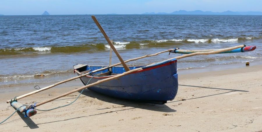 Out-rigger Fishing boat on beach near Padang on Sumatra